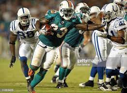 Miami Dolphins Running Back Ronnie Brown Gets Away With A Facemask On Miami Dolphins Dolphins Running Back
