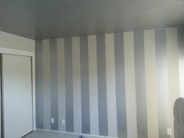 Painting wall patterns of different stripes on the wall add a clean, crisp look to any living room. Diy Interior Painting Vertical Stripes Make Ceilings Look Higher Painting Stripes On Walls Striped Walls Vertical Striped Walls