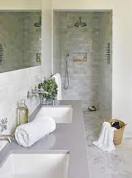 Established over 70 years ago in dallas, texas, 70 of our collections are proudly made in the usa. White And Gray Bathroom Boasts A White Dual Washstand Topped With Gray Quartz Fitted With His Modern Small Bathrooms Bathroom Countertops Small Bathroom Tiles