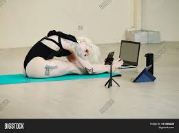 What does it mean when someone leans on their legs? Fit Young Woman Image Photo Free Trial Bigstock