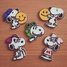 2名様分のオーダー完成 スヌーピー ベルちゃん お気に召して頂けますように ハンドメイド ビーズ ビーズ刺繍 オーダー オーダーメイド キャラクター peanuts スヌーピー フライングエース スマイル ニコちゃん ハグ ベル イニシャル リボン キュート 可愛い 特