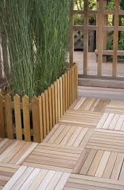 Deck Tiles An Easy And Inexpensive Diy Option Concrete Patio Makeover Patio Flooring Patio Tiles