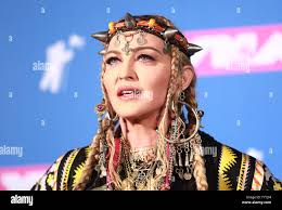 Madonna pose for photographers in the press room at the 35th annual MTV  Video Music Awards at Radio City Music Hall in New York City