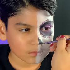 How cool is this calavera face painting tutorial for Día De Los Muertos!?