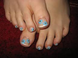 Flowers art on a white base. Pedicures Just Got Better With These 50 Cute Toe Nail Designs
