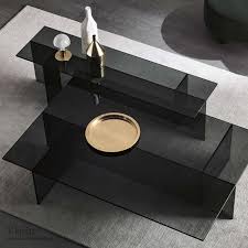 The contrasting materials, gold tone metal and glass, make the daidone modern coffee table by wrought studio™ an elegant and modern addition to your living room. Grey Tint Glass Archives Klarity Glass Furniture