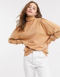 Model wears one size size guide: Saluscampusdemadrid Design Roll Neck Jumper With Open Back In Camel Saluscampusdemadrid
