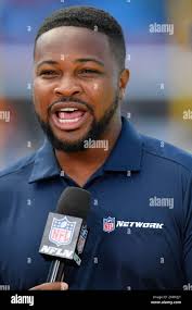 NFL Network's Cameron Wolfe reports from the sideline before a preseason  NFL football game between the Buffalo Bills and the Chicago Bears in  Orchard Park, N.Y., Saturday, Aug. 10, 2024. (AP Photo/Adrian