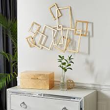 If the concrete block wall is painted and has a relatively smooth—not porous—finish, hanging pictures may be as simple as installing removable adhesive wall hooks. Harper Willow Abstract Rectangular Gold Metal Wall Decor 30 In X 22 In 86986 At Tractor Supply Co
