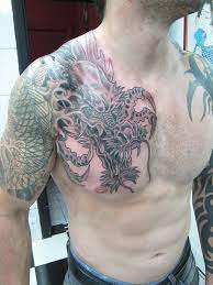 30 Awesome Dragon Tattoo Designs Cuded Dragon Tattoo Cool Chest Tattoos Tribal Shoulder Tattoos