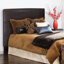 Hand crafted and upholstered in the us, this headboard has a solid wood frame, adjustable steel legs, and polyurethane foam padding. Slip Covered King Size Black Faux Leather Headboard Overstock 6753189