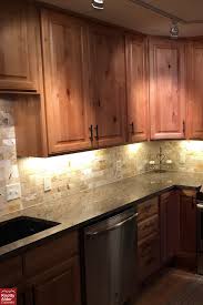 If you are trying to update your space, i prefer the greige wall colors paired with espresso stained cabinets. Knotty Alder Cabinets Natural Stain Kitchen Cabinets Dark Hardwood Flooring Light Brown Granite Coun Alder Kitchen Cabinets Kitchen Cabinets Alder Cabinets
