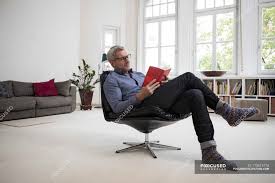 Vector silhouette of old people. Mature Man Sitting In Chair At Home And Reading Book Recreation Armchair Stock Photo 173612770