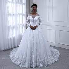 It gives you a fishy look. Bling Ball Gown Wedding Dresses Lace Pearls Long Sleeves Bridal Gowns Bling Brides Bouquet Online Bridal Store