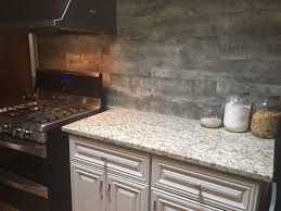 The kitchen backsplash is placed on the kitchen wall between the countertops and the wall cabinets. How To Install A Reclaimed Wood Backsplash Hampton Redesign