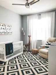 The modern nursery features clean lines and practical design. Elie S Black And White Modern Nursery Sunflowers And Stilettos Baby Nursery Design White Nursery Baby Room Decor