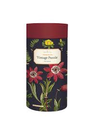 Puzzles are packaged in cardboard tubes, with puzzle . Cavallini Co Herbarium 1000 Piece Puzzle Two Hands Paperie