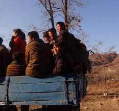 Check spelling or type a new query. Photo Of People Riding In The Back Of A Truck In North Korea