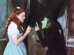 The History And Theories Behind The Traditional Witch Outfit, From Pointy  Hats To Flying Brooms