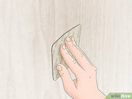 Using a damp cloth also removes excess spackle from surrounding paint so the only patch material is in the hole, not on the surrounding paint. How To Fill Nail Holes In Drywall Without Painting 9 Steps