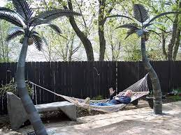 15 feet seems to be the standard for free standing hammock stands, so presumably that would work with palms. Custom Made Palm Trees Hammocks