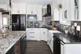 White appliances looking fab in the kitchen of designer mason st. How To Hide Your Refrigerator In Plain Sight With Appliance Panels Dura Supreme Cabinetry