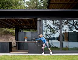 Tom's response to this challenge was as direct as the request: Olson Kundig Creates A Mechanized Cabin That Literally Invites The Outdoors In