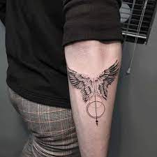 Top 91 Best Angel Wings Tattoo Ideas 2021 Inspiration Guide Forearm Band Tattoos Arm Tattoos For Guys Tattoos For Guys