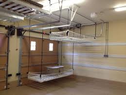 This is often associated with a rather chaotic and practically nonexistent storage system which ultimately results in a huge mess. Overhead Garage Storage The Perfect Storage Solution Darbylanefurniture Com Diy Overhead Garage Storage Garage Storage Systems Overhead Garage Storage