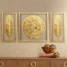 Iron wall art featuring layers of metal strips with crude edging, finished in an antique gold leaf and set on a distressed silver leaf iron backing. 7 Gold Metal Wall Art Ideas Metal Wall Art Wall Decor Gold Metal Wall Art