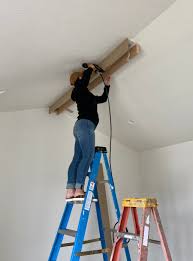 Typically faux beams are made from polyurethane and laminated with either real wood or a composite that stains like wood. Diy Box Beams Pitched Ceiling Remington Avenue