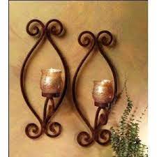 Some of these candle sconces includes more than simple scrolling or classic patterns. Tuscan Iron Metal And Amber Wall Candle Sconce Set Candle Sconces Candle Wall Sconces Sconces