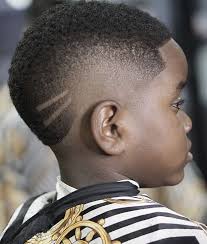 Medium black boy haircuts fade is given to adorn sides and the transitions into skin fade which covers occipital bone right to your neck's nape. 20 Eye Catching Haircuts For Black Boys