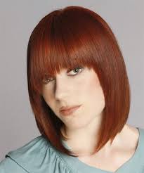 Medium length hairstyles are reaching new heights in their popularity each day, and there is no wonder why. Medium Straight Ginger Hairstyle With Asymmetrical Bangs