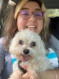 There's the one picture of me in here with our dog that means my little  brother and I