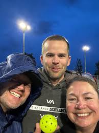 Pickleball games amidst stormy weather