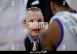 Drake head coach Darian DeVries talks to his team during a timeout in the  second half of an NCAA college basketball game against Indiana State,  Wednesday, Feb. 27, 2019, in Des Moines,
