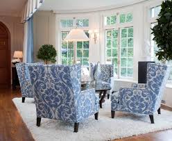 4 Wing Backs Around A Coffee Table In Blue And White Blue And White Living Room White Furniture Living Room Home Decor