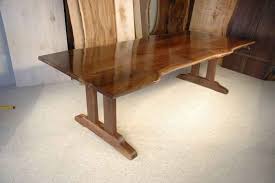 Wrapped in a rich natural walnut brown finish that enhances the beautiful grain of this wood dining set, the oscar combines solid wood and walnut. Rustic Walnut Slab Custom Trestle Dining Table Dumond S Furniture