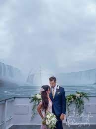 Super Romantic Photo Of Bride And Groom Right Under Niagara Falls Aboard The Guardian Hornblower Niag Niagara Falls Wedding Yacht Wedding Fall Wedding Photos