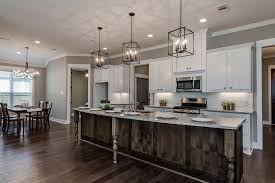 With a little work and a few basic diy skills, you can brighten a large or small kitchen design with fresh paint and new cabinet hardware. Open Concept Kitchen With Large Island Open Concept Kitchen Lights Over Dining Table Home