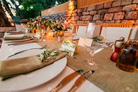 A rough wooden table would be ideal for such a setting, you may even not use a tablecloth. Plate At The Wedding Table Rustic Table Setting At A Wedding Banquet Decoration Flowers A Close Up Of A Plate With Cutlery Stock Photo Picture And Royalty Free Image Image 85749076