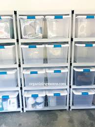 Cubbies are a great way to keep all the garage stuff. How To Organize A Garage The Easy Way Storage Bins Organization Medication Organization Storage Garage Storage Bins