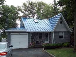 Whether you're building a new home or want to replace your existing roof, there's no better option than steel. Blue Metal Roof On Charming Lakehouse Cottage House Exterior Colors Blue Exterior House Colors Metal Roof Houses