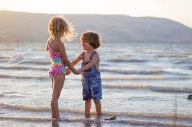 Kids playing on the beach. Kids Playing On Beach Pictures Download Free Images On Unsplash