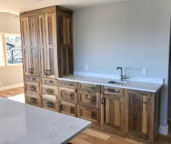 The white color mixed with the dark knots make for a very rustic feel.early 20th century … Knotty Rustic Hickory Cabinets Rustic Kitchen By Tree Fever Designs Houzz