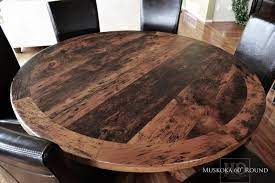 Reclaimed Wood Round Table With Epoxy Polyurethane Finish Www Hdthreshing Com Round Wood Dining Table Wood Dining Table Rustic Round Dining Room Sets