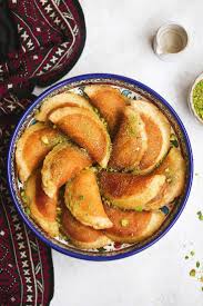 21 Addictive Arabic Treats And Desserts That Will Make You An Instant Fan Middle Eastern Recipes Arabic Food Atayef Recipe Arabic Sweets Recipes