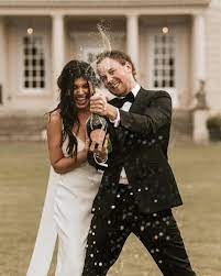 Champagne Popping Wedding Photo Spain Wedding Photographer Buxted Park Hotel Wedding Kent Wedding Photographer Wedding Photos