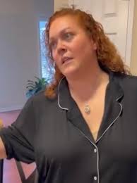 who is the man in the background?